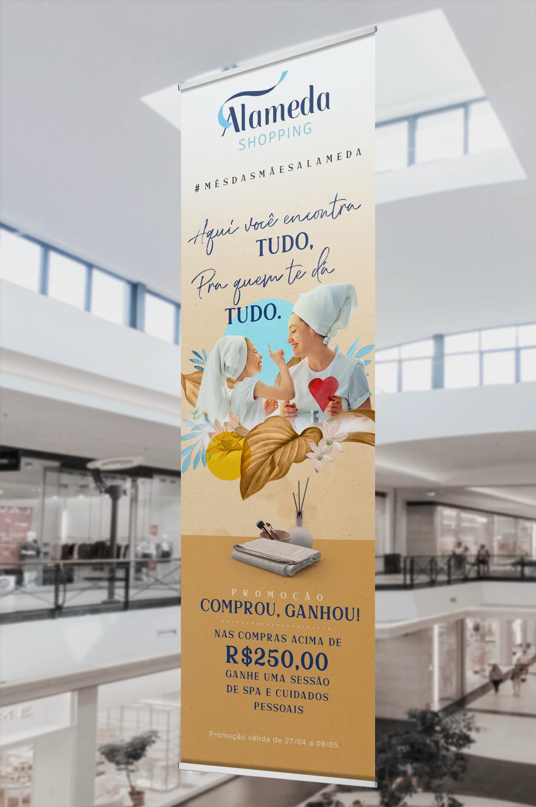 Indoor banner hanging in the mall atrium with the campaign art