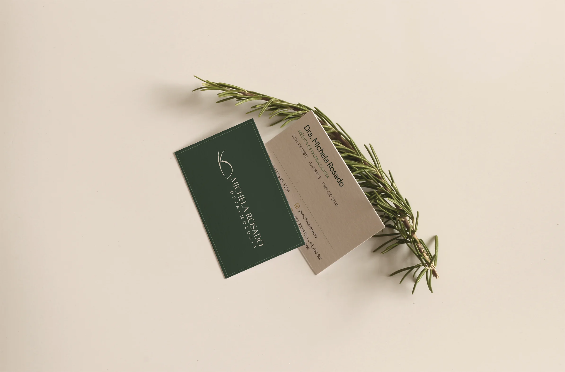 Business cards with a rosemary sprig